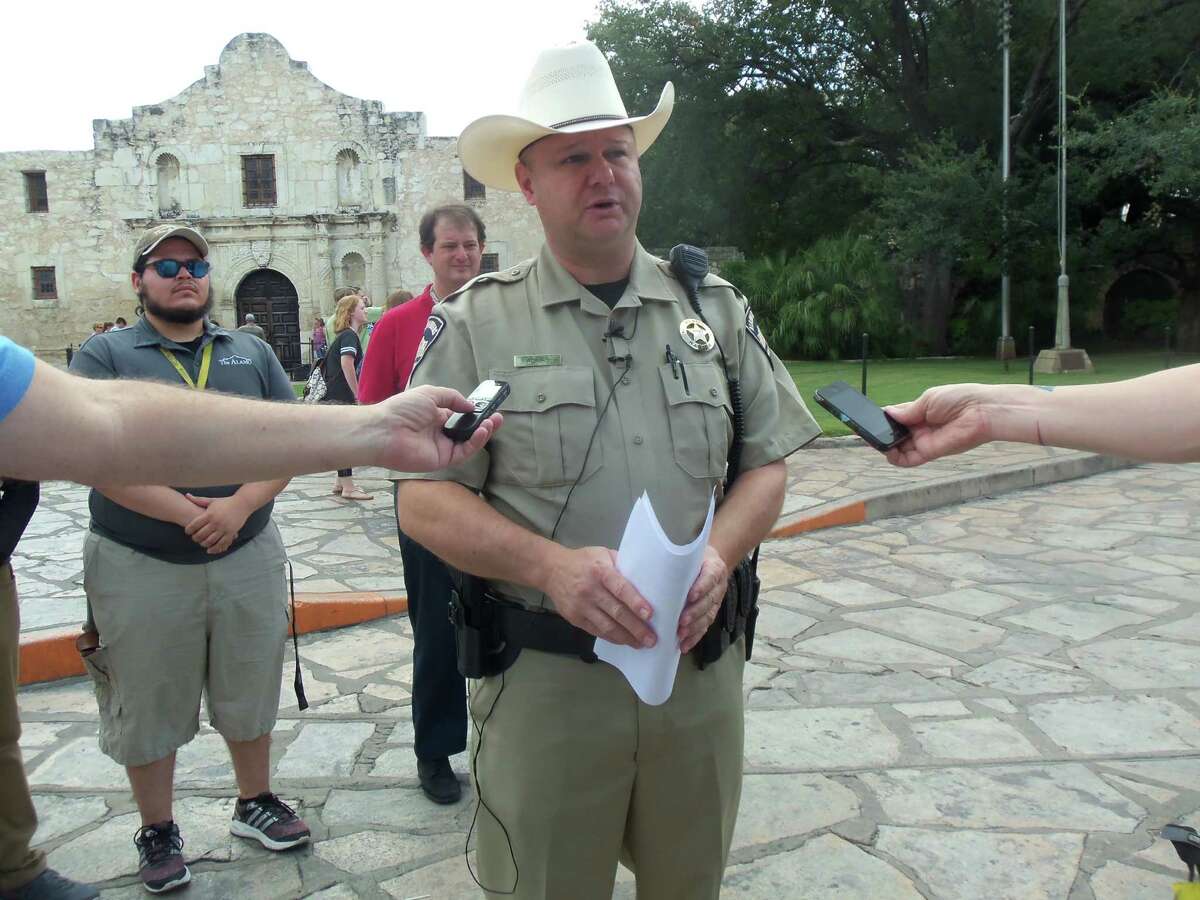 Alamo Rangers Chief Mark Adkins said a female tour guide acted quickly to help catch the man accused of etching his name into a 250-year-old limestone wall Thursday at the Alamo, resulting in an arrest.