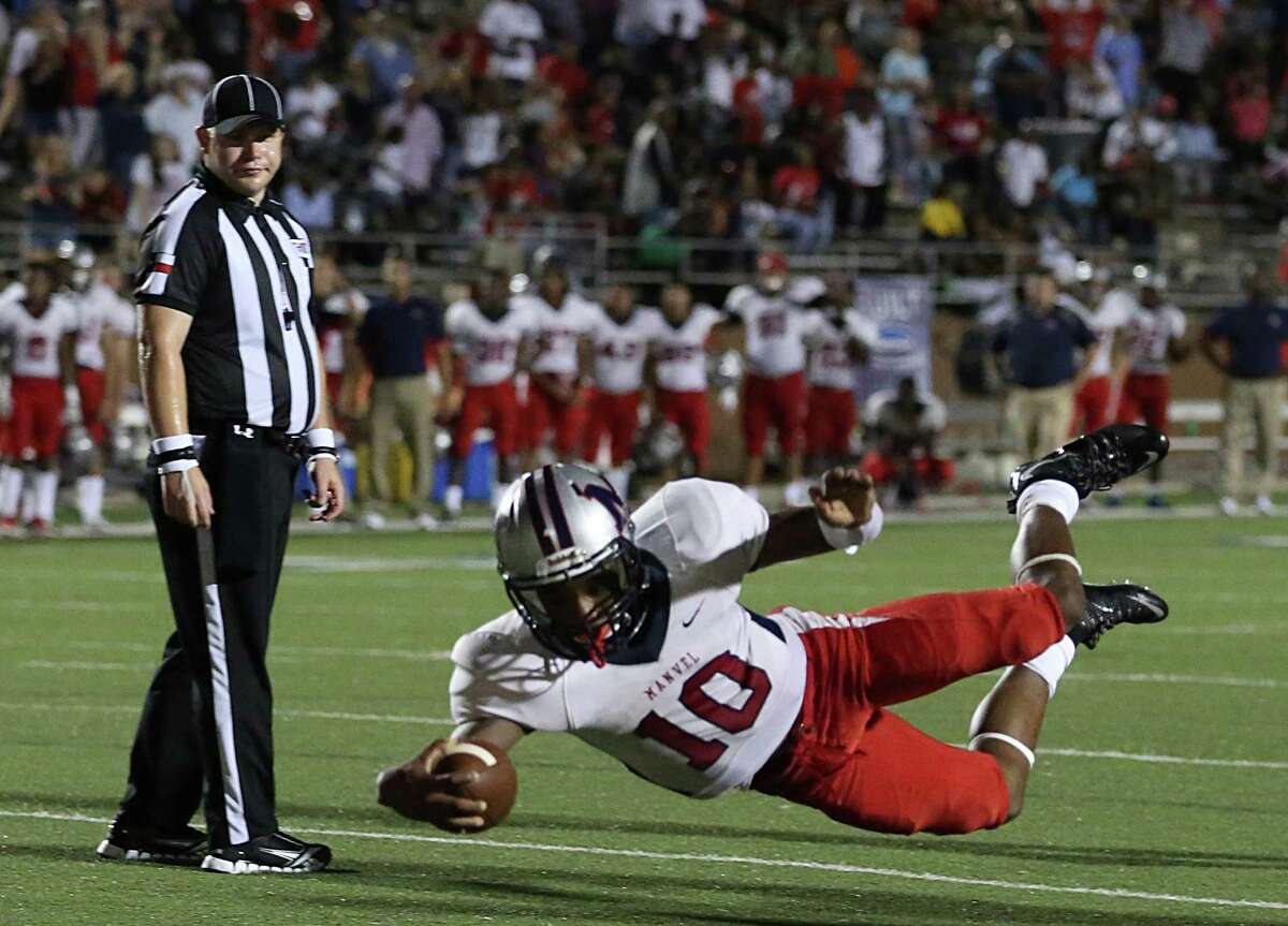 Manvel quarterback Deriq King (10) dives into the ends zone for a 10-yard touchdown late in his team's win over North Shore on Friday.