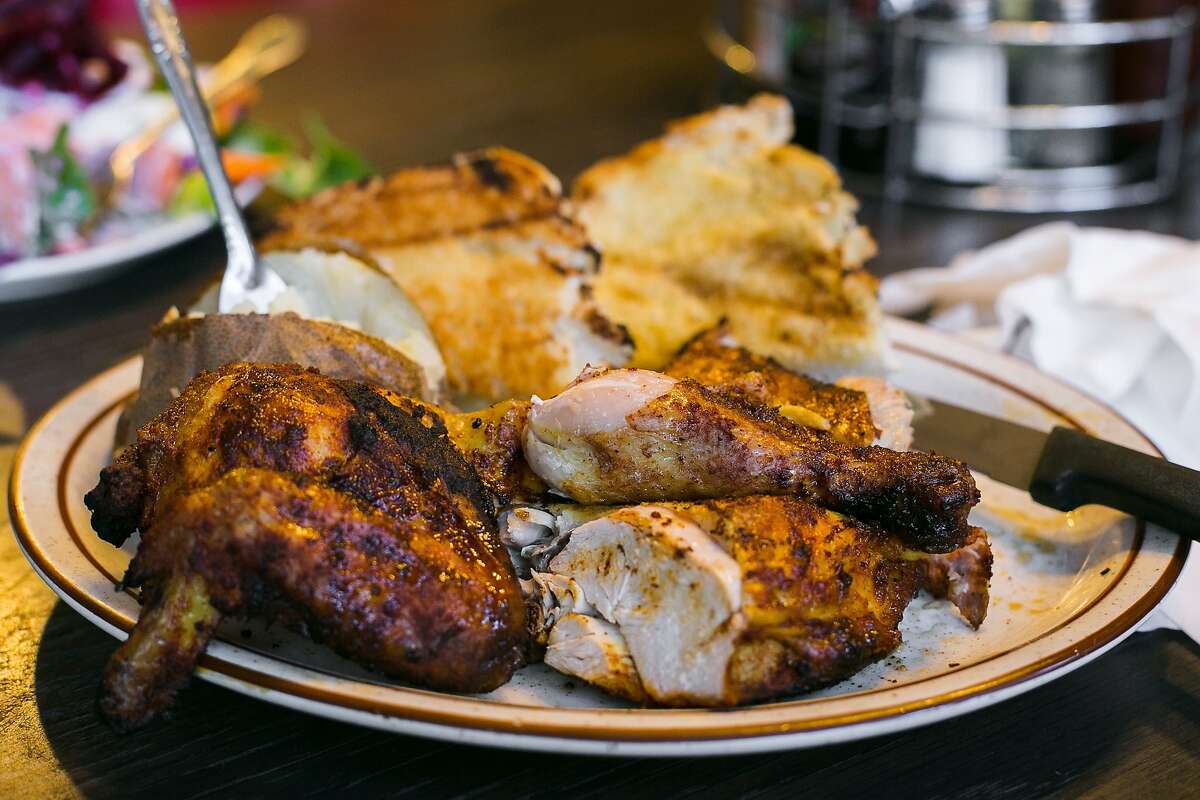 A salad is served with the half chicken at Geneva Steakhouse.