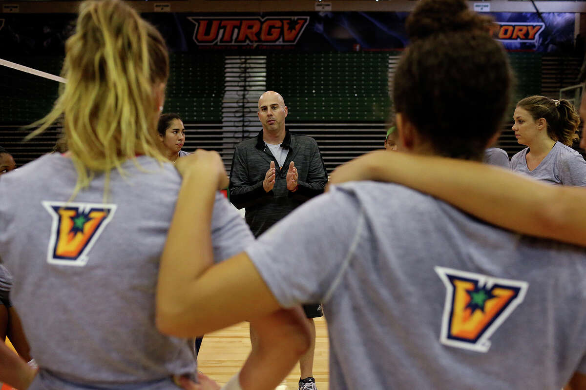 University of Texas Rio Grande Valley volleyball head coach Todd Lowery works with the team during practice at the Edinburg campus Thursday. The campus was formerly known as the University of Texas Pan American until it merged with the University of Texas Brownsville. Lowery was hired as head coach for the UTRGV team after winning two national championships as head coach for the University of Texas Brownsville volleyball team.