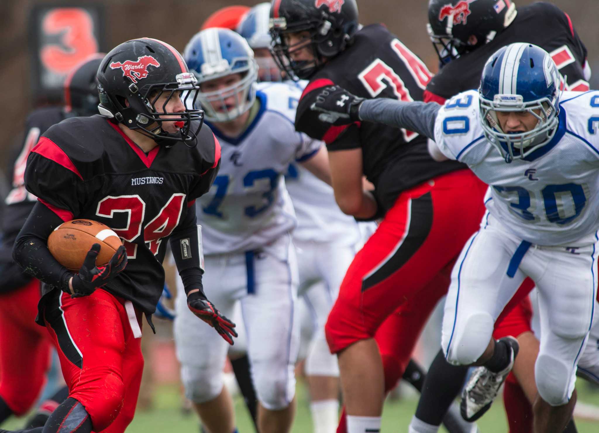 New Canaan football tops Warde for eighth victory