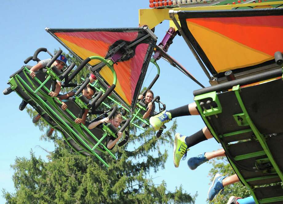 People enjoy the hang glide ride at the Columbia County Fair on Monday, Sept. 7, 2015 in Chatham, N.Y.  (Lori Van Buren / Times Union) Photo: Lori Van Buren / 10032907A
