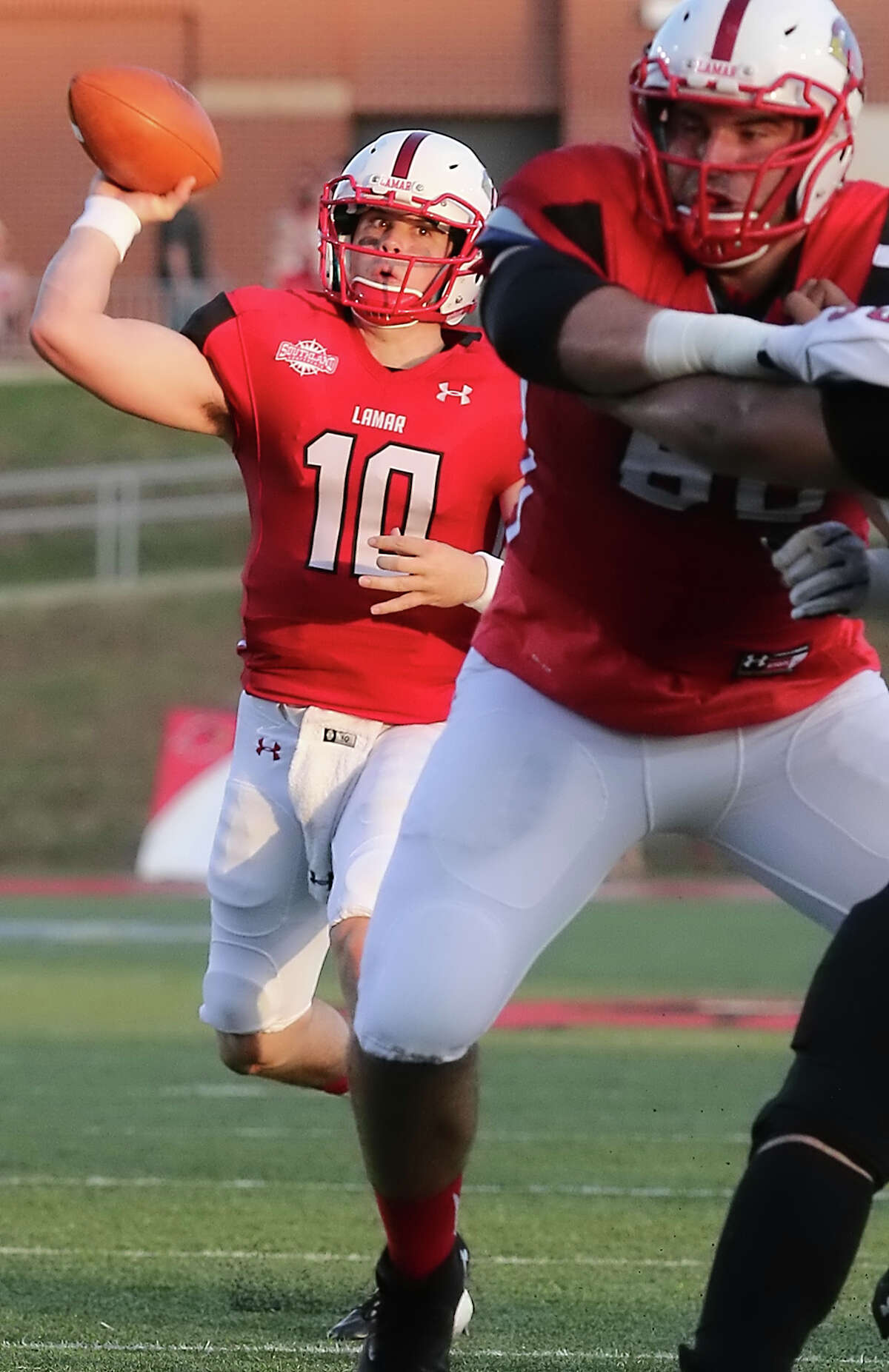 Sept. 5, vs. Bacone College: 66-3 W Joe Mindon, 10, passes the ball during the game between the Lamar Cardinals and Bacone College at Provost Umphrey Stadium Saturday night, September 5th, 2015 - photo provided by Kyle Ezell