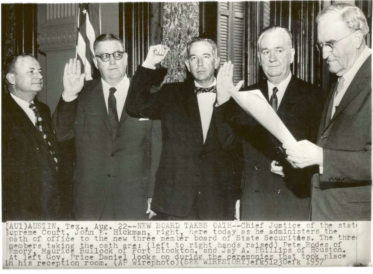 State Supreme Court Chief Justice John Hickman, right, swears in new members to the Texas State Securities Board in 1957.