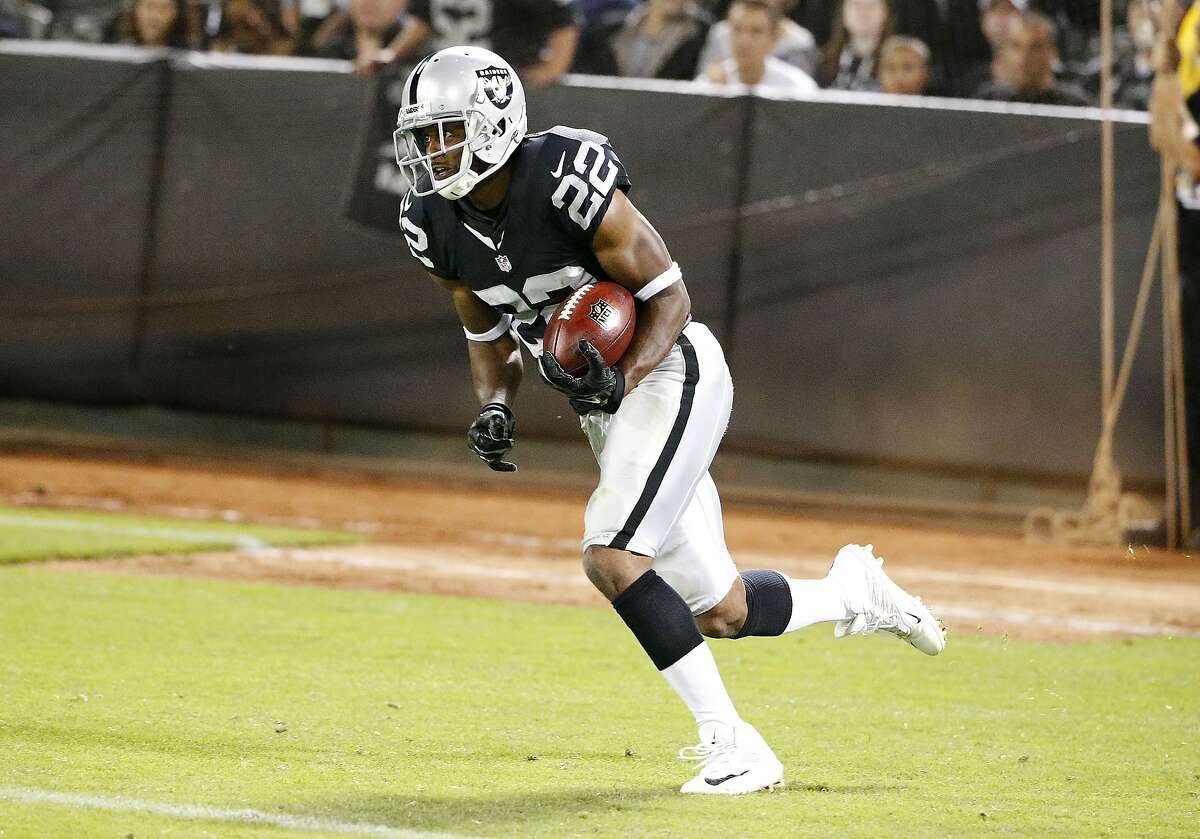 Oakland Raiders running back Taiwan Jones (22) against the St. Louis Rams during the second half of an NFL preseason football game in Oakland, Calif., Friday, Aug. 14, 2015. (AP Photo/Tony Avelar)
