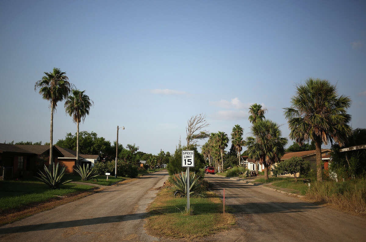 Boca Chica Village, in one of Texas' poorest counties, sits on a dusty fleck of land between wind-swept sand dunes, emerald marshes and a desolate white beach. The community of about three dozen houses, filled with mainly seasonal blue-collar workers and retirees, was built in the 1960s.
