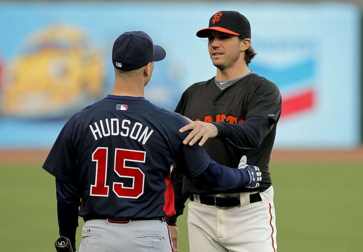 Former teammates, Tim Hudson, with the Braves and Barry Zito of the Giants, greet one another during Atlanta's practice, as the San Francisco Giants and the Atlanta Braves take to the field at AT&T Park in San Francisco, Calif., for the final day of batting practice on Wednesday Oct. 6, 2010 before the start of the National League Division Series playoffs.