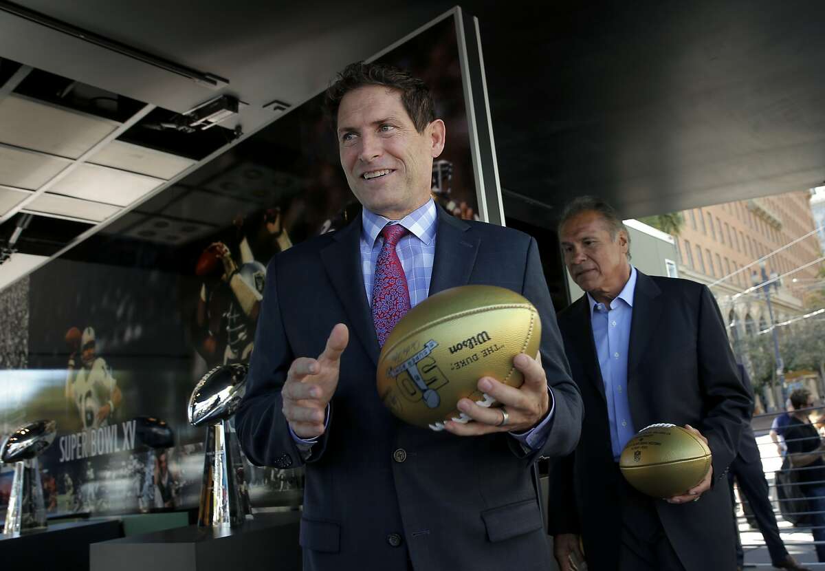 San Francisco 49er great Steve Young, (left) and Oakland Raider great Jim Plunkett were on hand, as the NFL and the Bay Area Super Bowl Committee officially kicked off the football season with an event to unveil a mobile exhibit designed to celebrate the history of the Bay Area champion Oakland Raiders and San Francisco 49ers showcasing the 8 Super Bowl trophies the teams have won, currently at Justin Herman Plaza on Tues. September 9, 2015, in San Francisco, Calif. San Francisco will host Super Bowl 50 in Santa Clara at the end of the NFL season.