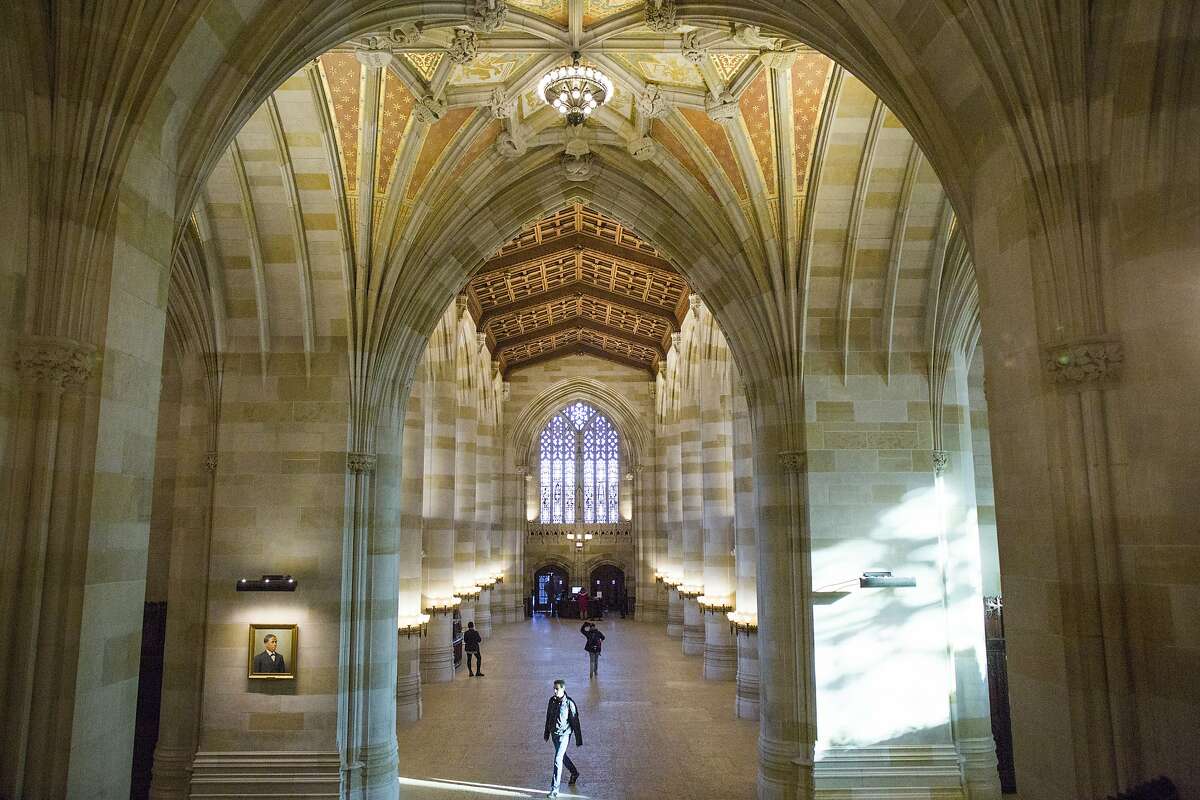 Click to learn the oldest colleges in each state, according to Business Insider. Pictured: Yale University library
