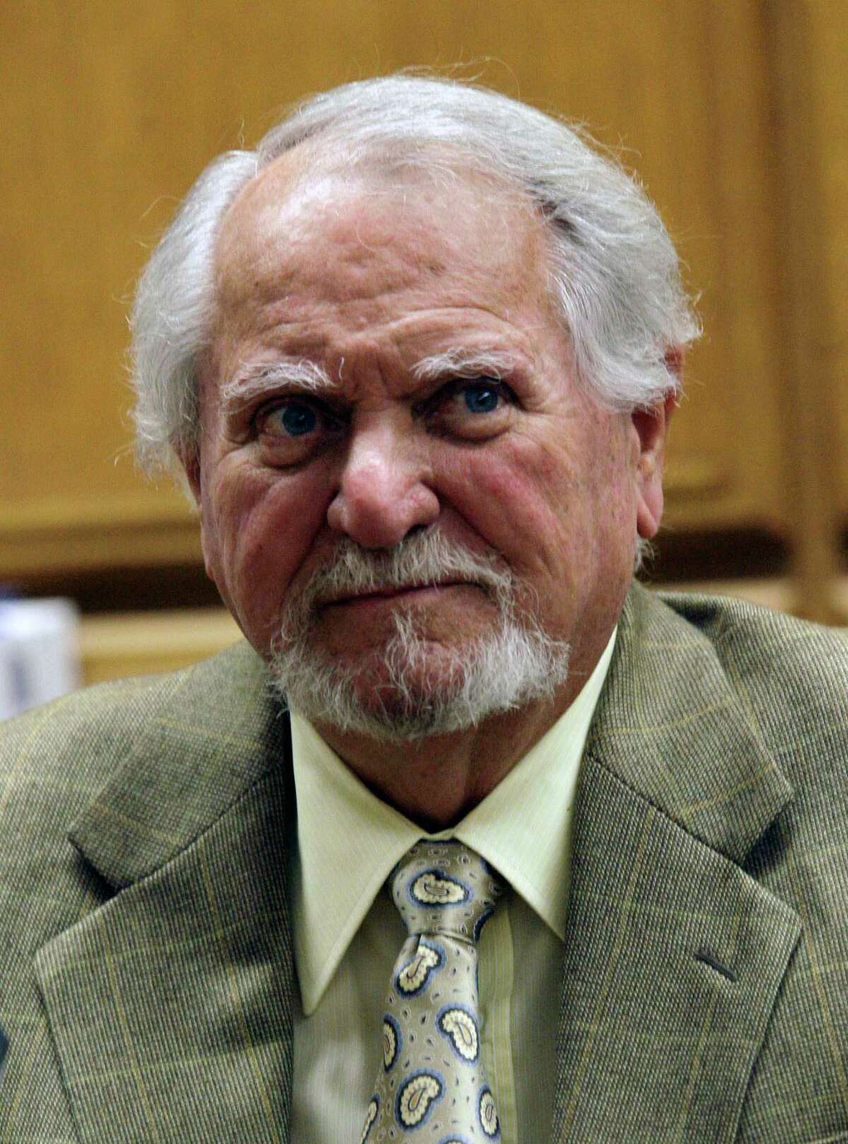 FILE - In this Feb. 13, 2007 file photo, best-selling author Clive Cussler waits to testify in court in a lawsuit over the film, "Sahara," in Los Angeles. (AP Photo/Nick Ut, file)