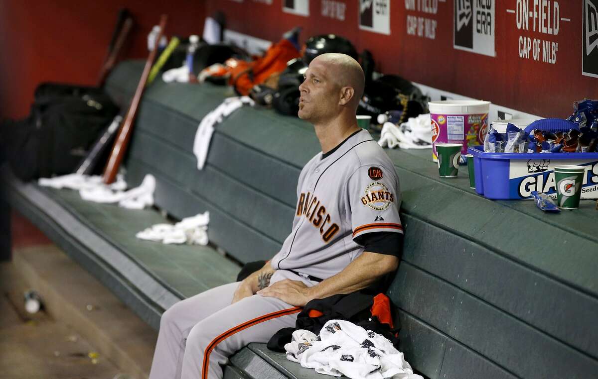 San Francisco Giants' Tim Hudson sits in the dugout during the seventh inning of a baseball game against the Arizona Diamondbacks Tuesday, Sept. 8, 2015, in Phoenix. The Giants defeated the Diamondbacks 6-2. (AP Photo/Ross D. Franklin)