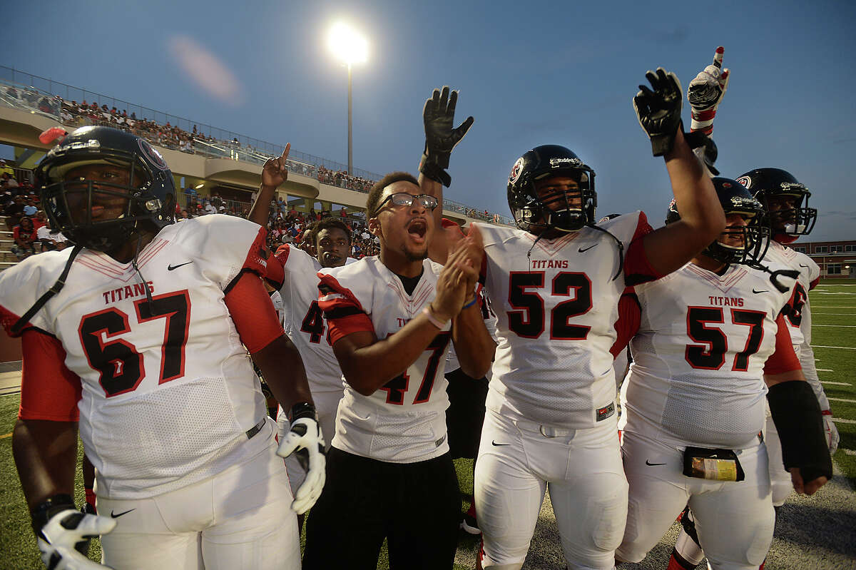 Port Arthur Memorial's sideline celebrates as they cheer on the offense's advance over Central during their match-up Saturday at "The Butch" in Beaumont. Photo taken Saturday, September 5, 2015 Photo by Kim Brent