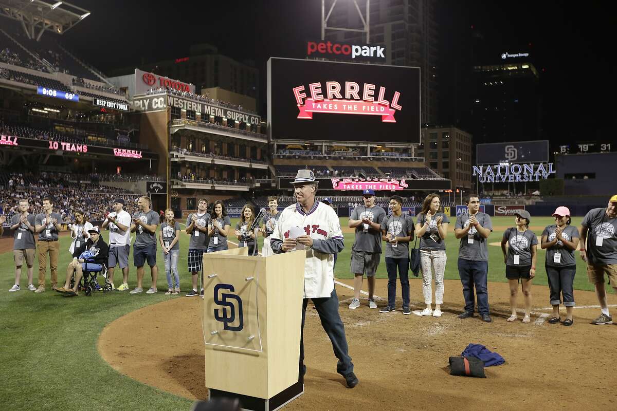 Actor Will Ferrell stands in front of cancer survivors before a screening of the new comedy special, "Ferrell Takes the Field," by HBO, after a baseball game between the San Diego Padres and the Los Angeles Dodgers Saturday, Sept. 5, 2015 in San Diego. (AP Photo/Gregory Bull)