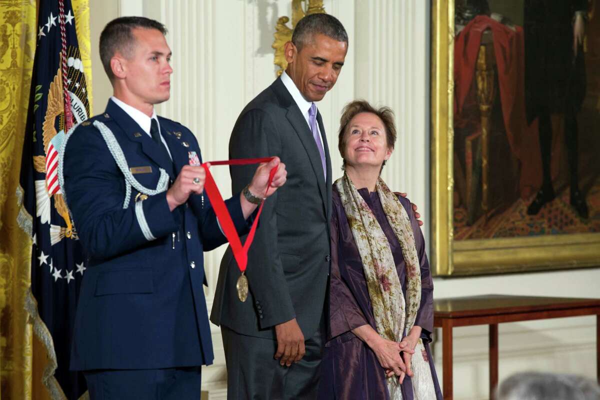 Chef, author and advocate Alice Waters of Berkeley (right) stands with President Obama before being presented with the National Humanities Medal in the East Room of the White House.