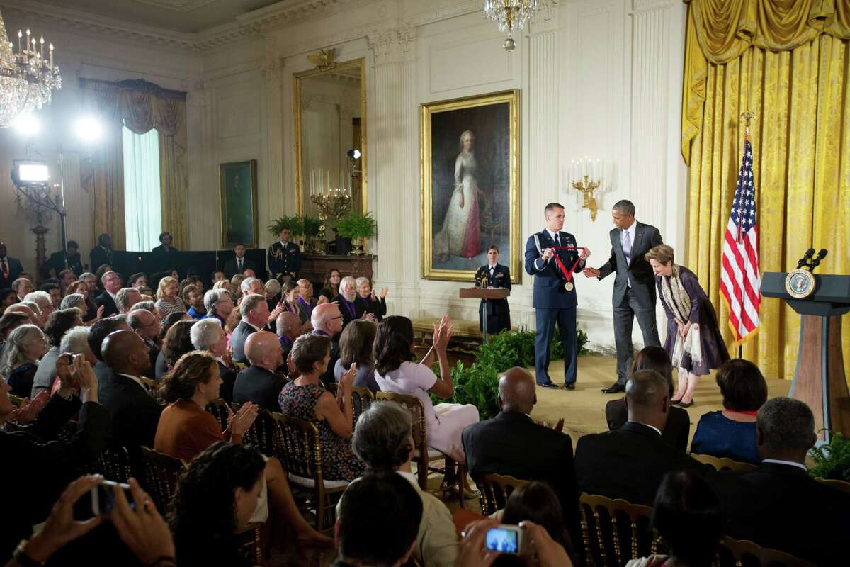 President Barack Obama awards the 2014 National Humanities Medal to Chef, Author, and Advocate Alice Waters of Berkeley, Calif. during a ceremony in the East Room at the White House in Washington, Thursday, Sept. 10, 2015. (AP Photo/Andrew Harnik)
