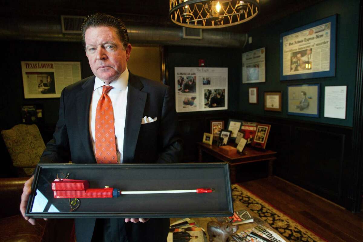 Attorney Dan Cogdell poses for a portrait holding a cattle prod in his office Friday, Feb. 1, 2013, in Houston. ( Brett Coomer / Houston Chronicle )