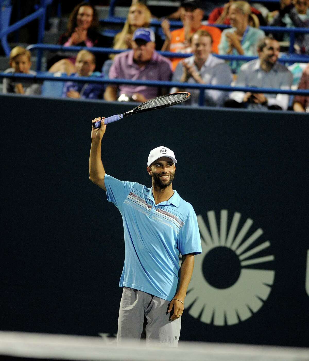 In this Thursday, Aug. 27, 2015, photo, James Blake gestures during an exhibition match at the Connecticut Open tennis tournament in New Haven, Conn. Former tennis star James Blake said Thursday, Sept. 10, 2015, he wants an apology after a case of mistaken identity led police to handcuff him and take him to the ground, but New York's police commissioner said Blake hasn't returned his calls. (AP Photo/Fred Beckham)
