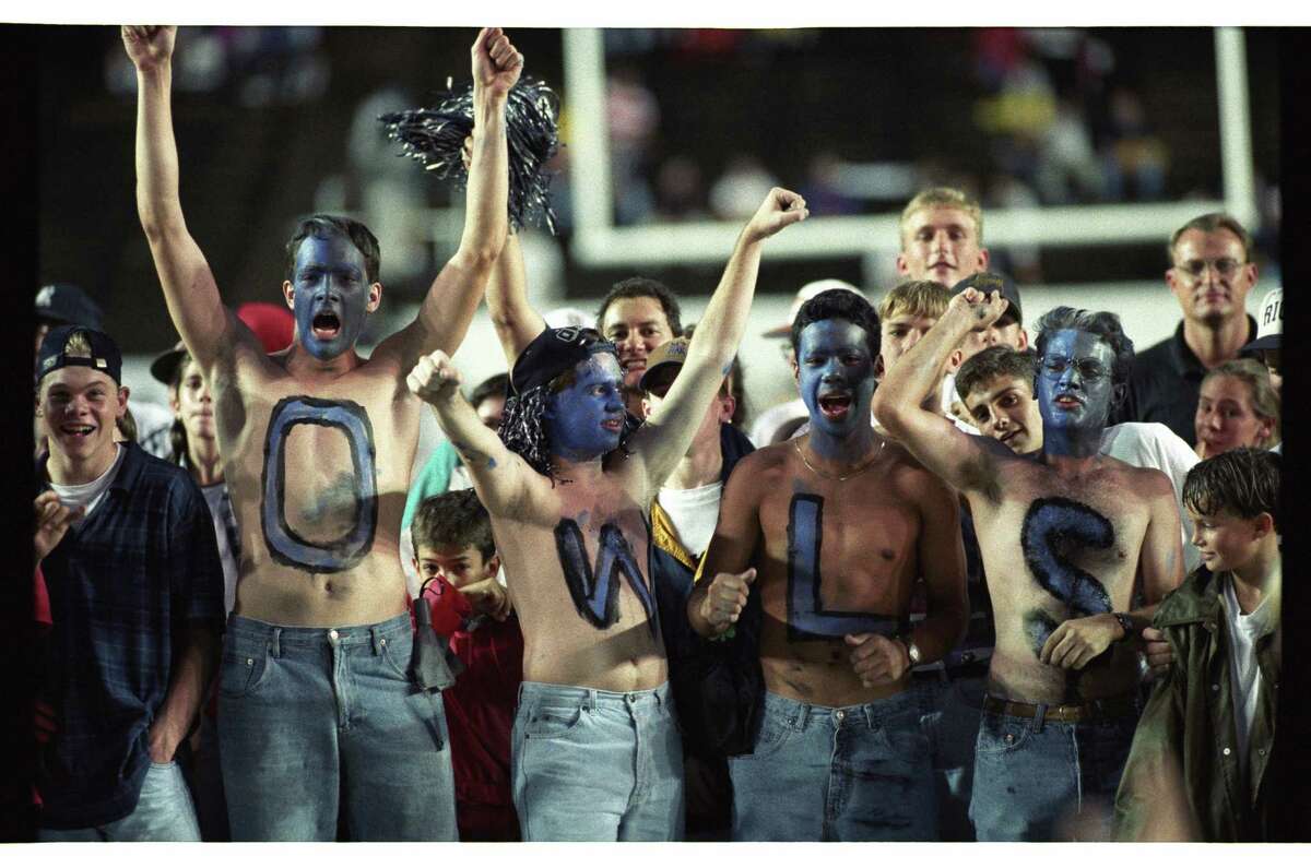 10/16/1994 Rice University vs UT - Longhorns: HOUCHRON Caption (10/17/1994): Rice University fans, Kristof Richmond, Steve Gauvrain, Miguel Castillo and Thomas Reed spell out their sympathies and show their true colors with blue-painted faces at Rice Stadium.
