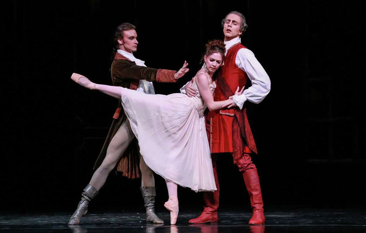 Melody Mennite, center, is a Manon controlled by her powerful brother Lescaut (Jared Matthews, left) and domineering keeper Monsieur G.M. (Linnar Looris).