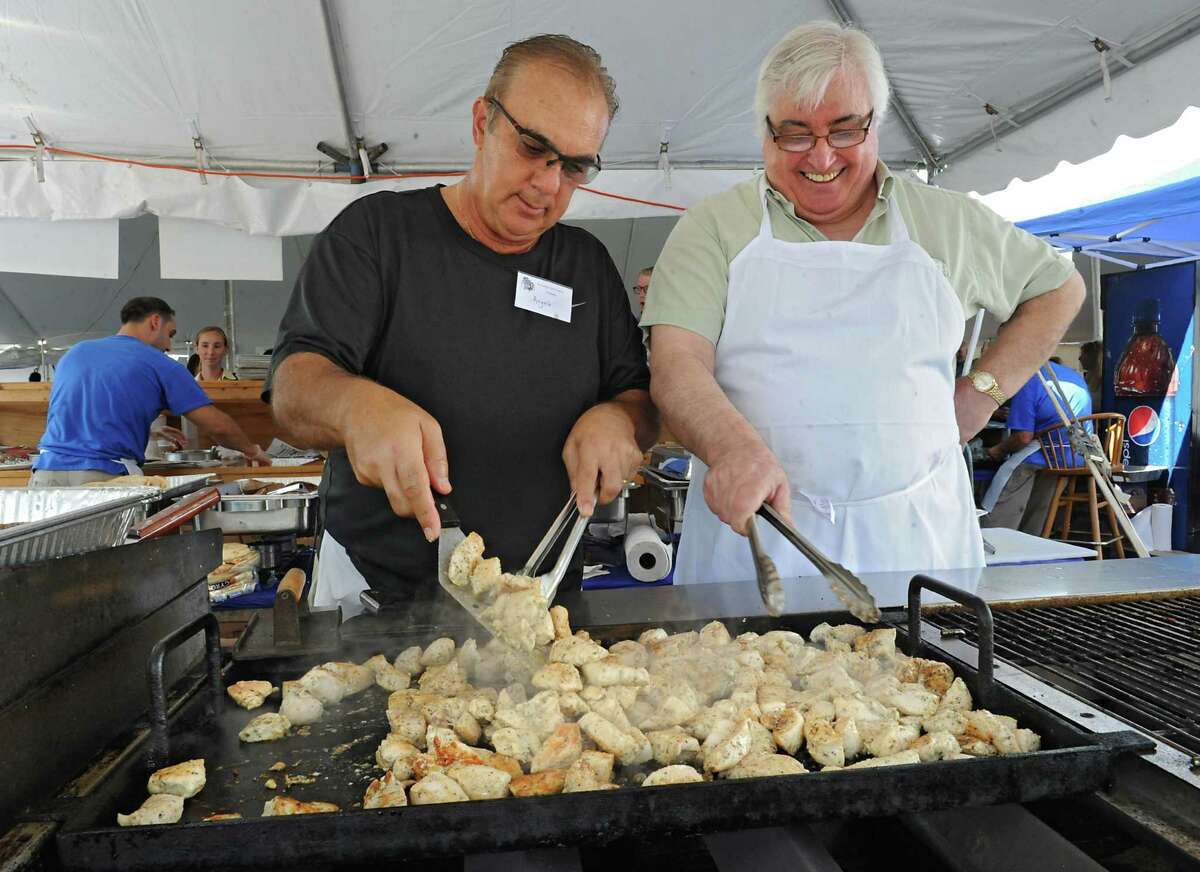 Angelo Menagias of Niskayuna, left, and Nick Paravalos of Clifton Park cook chicken at the 40th Annual St. George Greek Festival at the Hellenic Center on Friday, Sept. 11, 2015 in Schenectady, N.Y. (Lori Van Buren / Times Union)