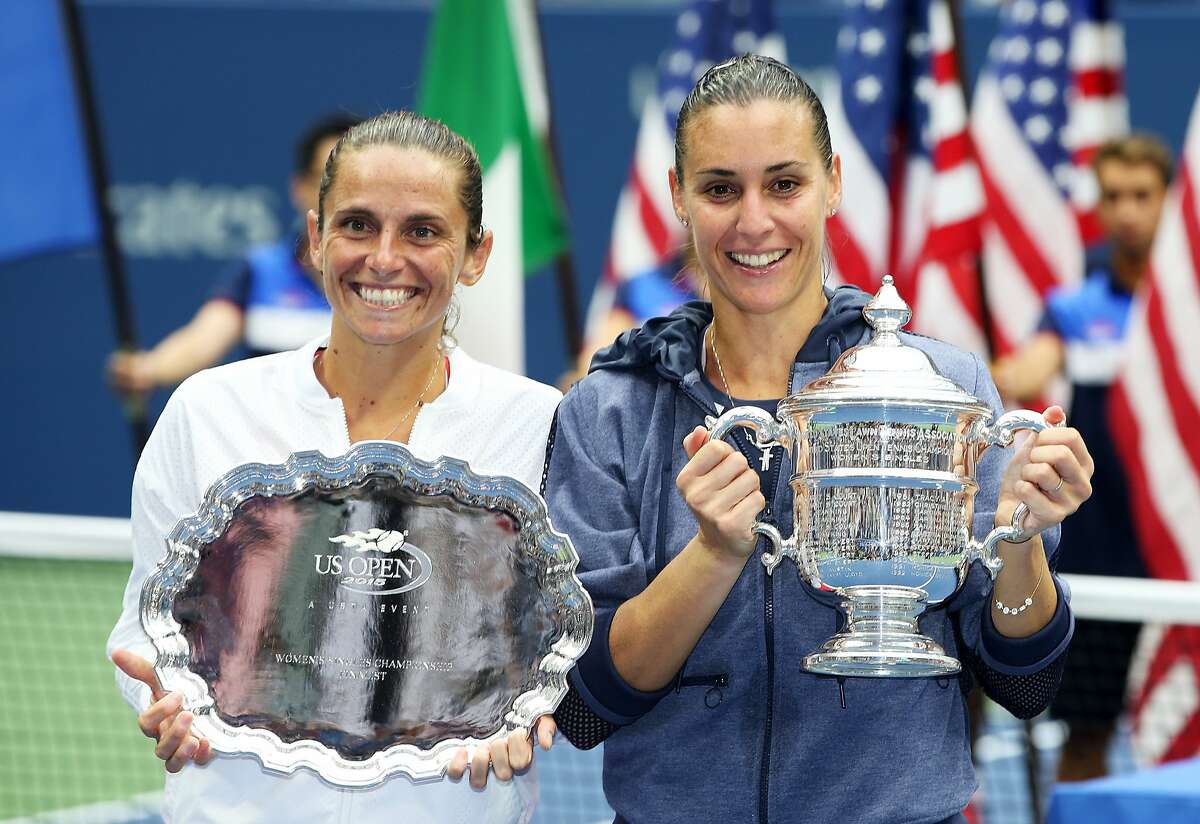 NEW YORK, NY - SEPTEMBER 12: Flavia Pennetta (R) of Italy and Roberta Vinci (L) of Italy pose with their trophies after their Women's Singles Final match on Day Thirteen of the 2015 US Open at the USTA Billie Jean King National Tennis Center on September 12, 2015 in the Flushing neighborhood of the Queens borough of New York City. Pennetta defeated Vinci 7-6, 6-2. (Photo by Matthew Stockman/Getty Images)