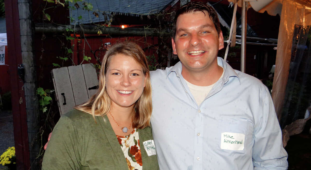 Wakeman Town Farm's stewards Carrie and Mike Aitkenhead at the center's annual Harvest Fest on Saturday night.