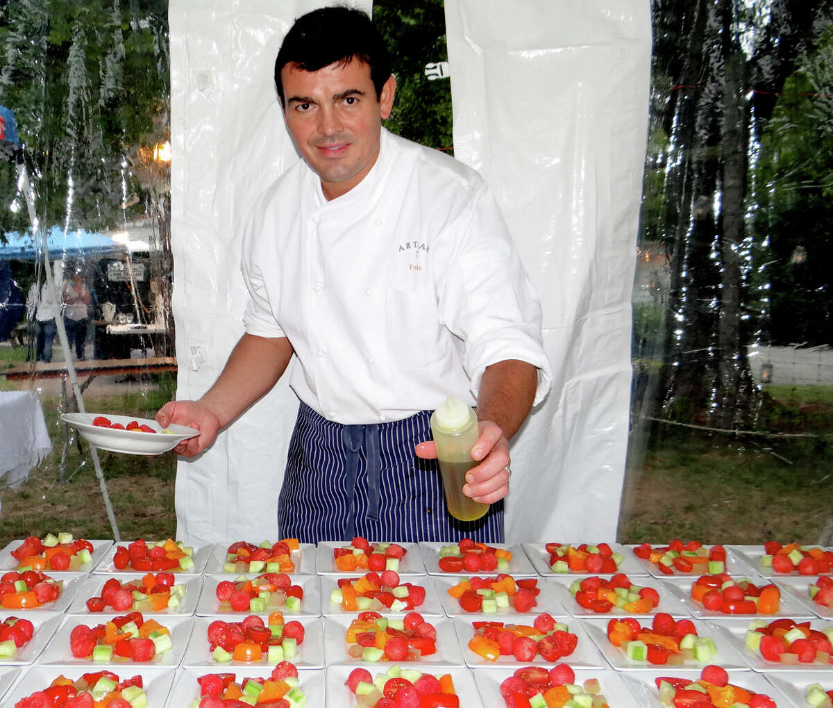 Chef Frederic Kieffer of Artisan Restaurant preparing late-summer tomato salads at Wakeman Town Farm's Harvest Fest dinner.