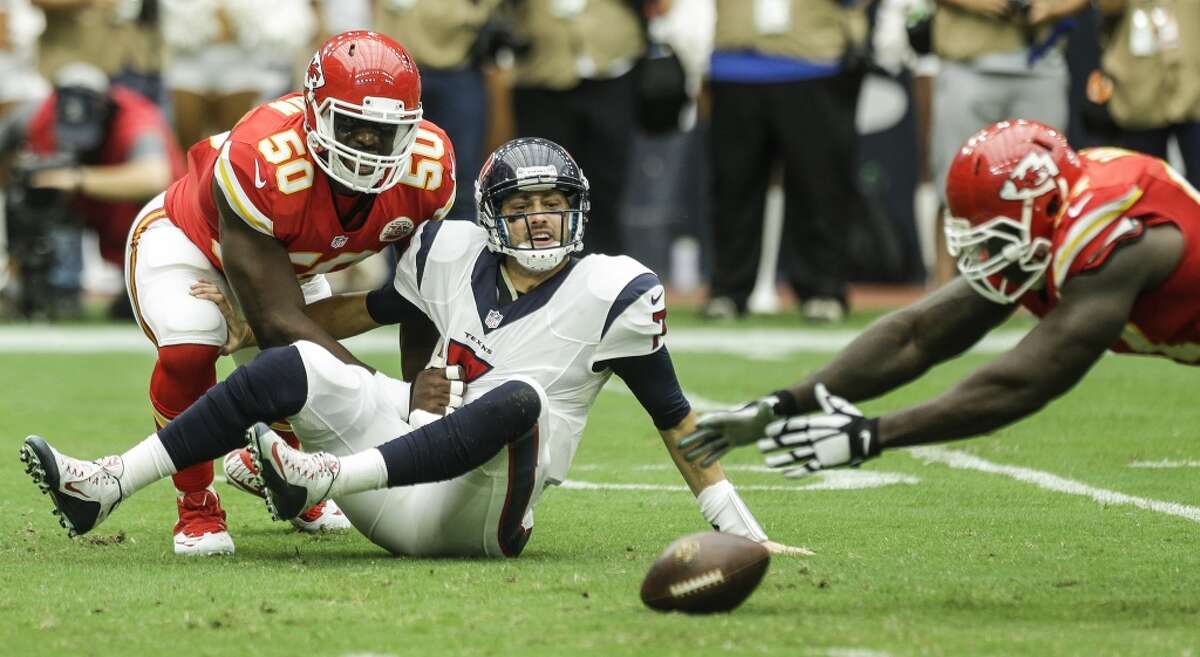 Kansas City Chiefs defensive end Allen Bailey (97) dives on a fumble by Houston Texans quarterback Brian Hoyer (7) after Hoyer was sacked by Chiefs outside linebacker Justin Houston (50) during the second quarter of an NFL football game at NRG Stadium on Sunday, Sept. 13, 2015, in Houston. ( Brett Coomer / Houston Chronicle )