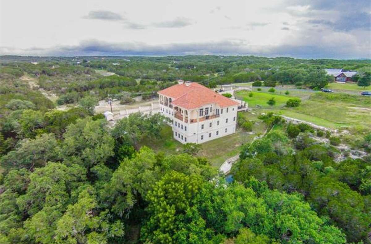 This massive mansion in Austin has a garage that could easily fit about 20 cars inside of it. It also has numerous amenities and a gorgeous view of the Texas Hill Country.