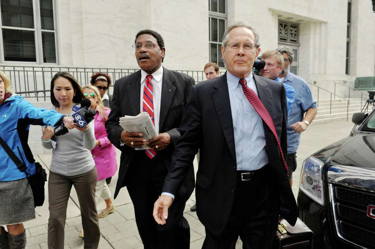 Former state Assemblyman William Scarborough, left, and his attorney E. Stewart Jones leave the Federal Courthouse following Scarborough's sentencing on Monday, Sept. 14, 2015, in Albany, N.Y. (Paul Buckowski / Times Union)