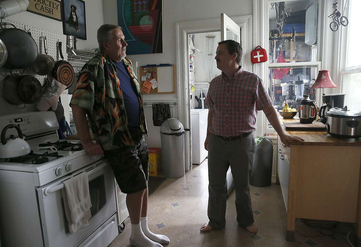 Tenants Ed Wolf (left) and Kirk Read (right) talk about nearly being evicted until the city stepped in to provide a $2 million loan so a nonprofit could purchase the historic six flat unit in San Francisco, Calif., on Monday, September 14, 2015.