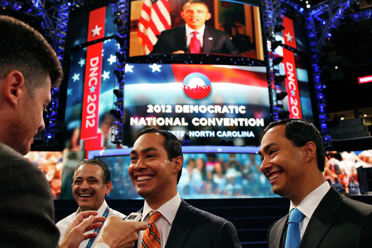 Mayor Julián Castro, center, and his brother, Joaquin Castro, are interviewed in Time Warner Arena as they prepare for the Democratic National Convention in Charlotte, N.C., on Sept. 3, 2012.