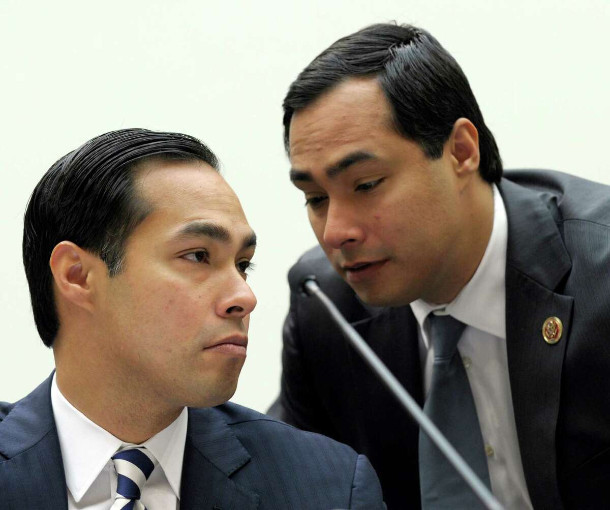 San Antonio Mayor Julián Castro (left) talks with his brother Rep. Joaquin Castro, D-Texas, right, on Capitol Hill in Washington, D.C., Feb. 5, 2013, prior to testifying before the House Judiciary Committee hearing on America's Immigration System: Opportunities for Legal Immigration and Enforcement of Laws against Illegal Immigration.