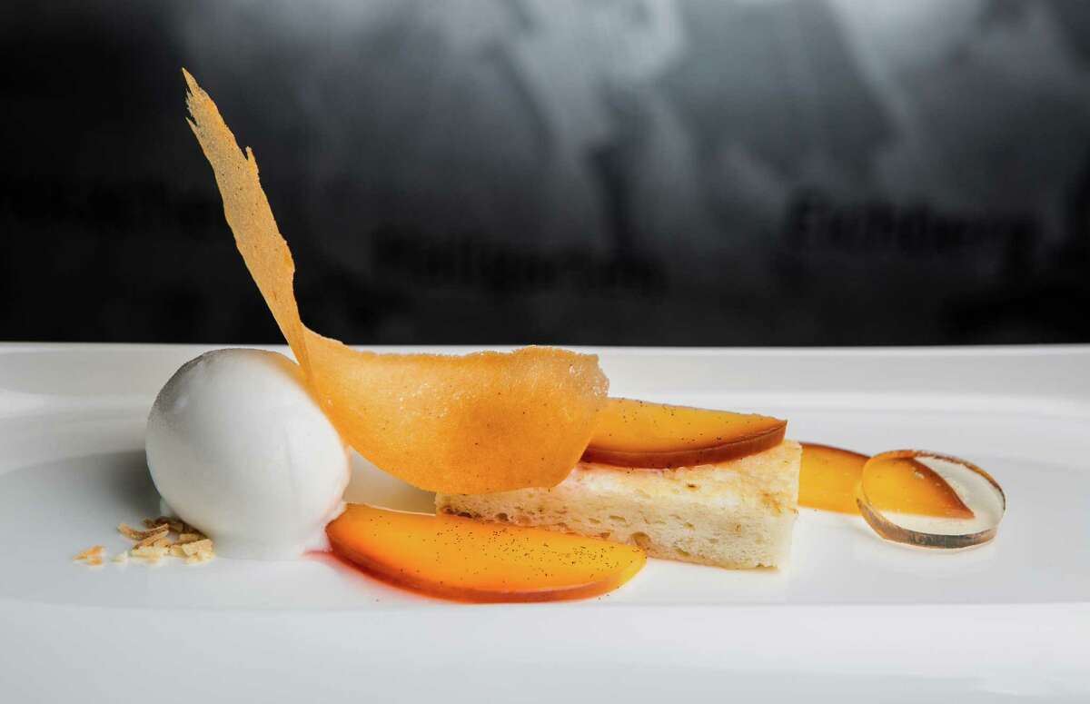 Almond tonka bean cake with peaches, coconut kaffir lime sorbet and grand marnier gel at Cureight