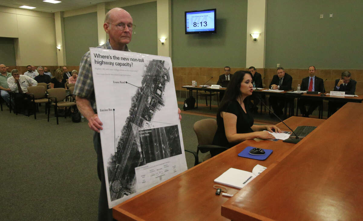 Pat Dossey, left, standing, and Terri Hall, right, seated, address the Alamo Area Metropolitan Planning Organization on Monday. Hall is director of Texans Uniting for Reform and Freedom and was voicing her stance against tolls and high-occupancy-vehicle lanes on U.S. 281, which will be rebuilt north of Loop 1604.