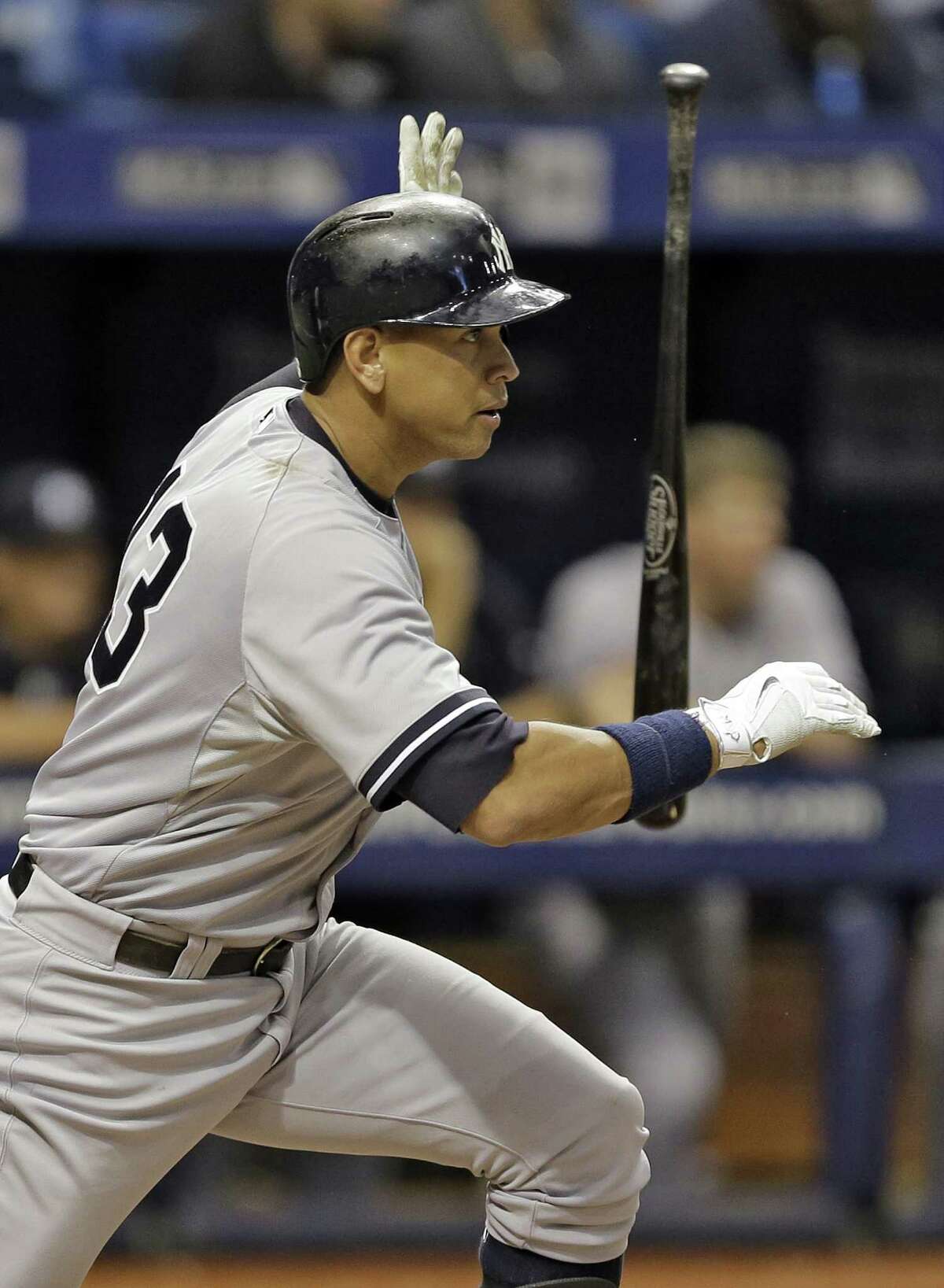 New York Yankees' Alex Rodriguez flips his bat after hitting an RBI double off Tampa Bay Rays relief pitcher Brad Boxberger during the ninth inning of a baseball game Monday, Sept. 14, 2015, in St. Petersburg, Fla. Yankees' Brett Gardner scored on the hit. The Yankees defeated the Rays 4-1. (AP Photo/Chris O'Meara) ORG XMIT: SPD122