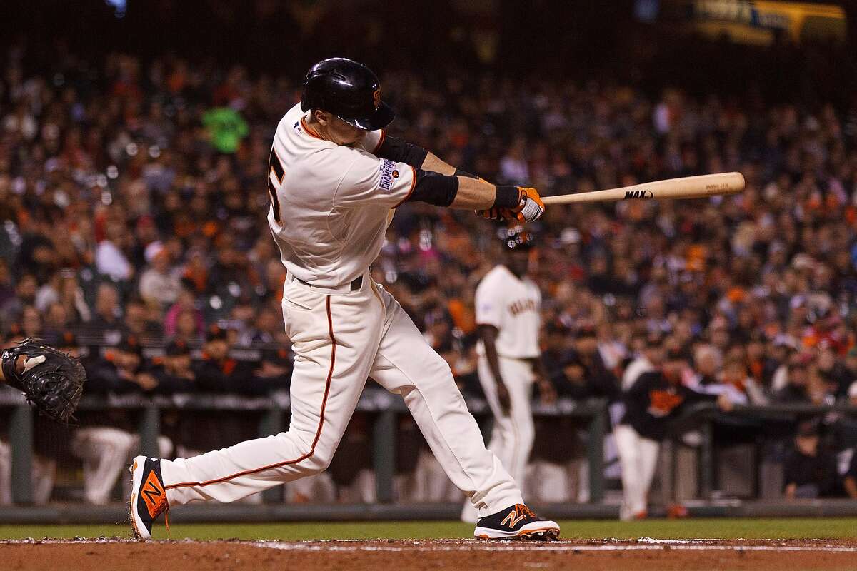 Matt Duffy of the San Francisco Giants hits a two-run double against the Cincinnati Reds during the first inning at AT&T Park on September 14, 2015 in San Francisco, California.