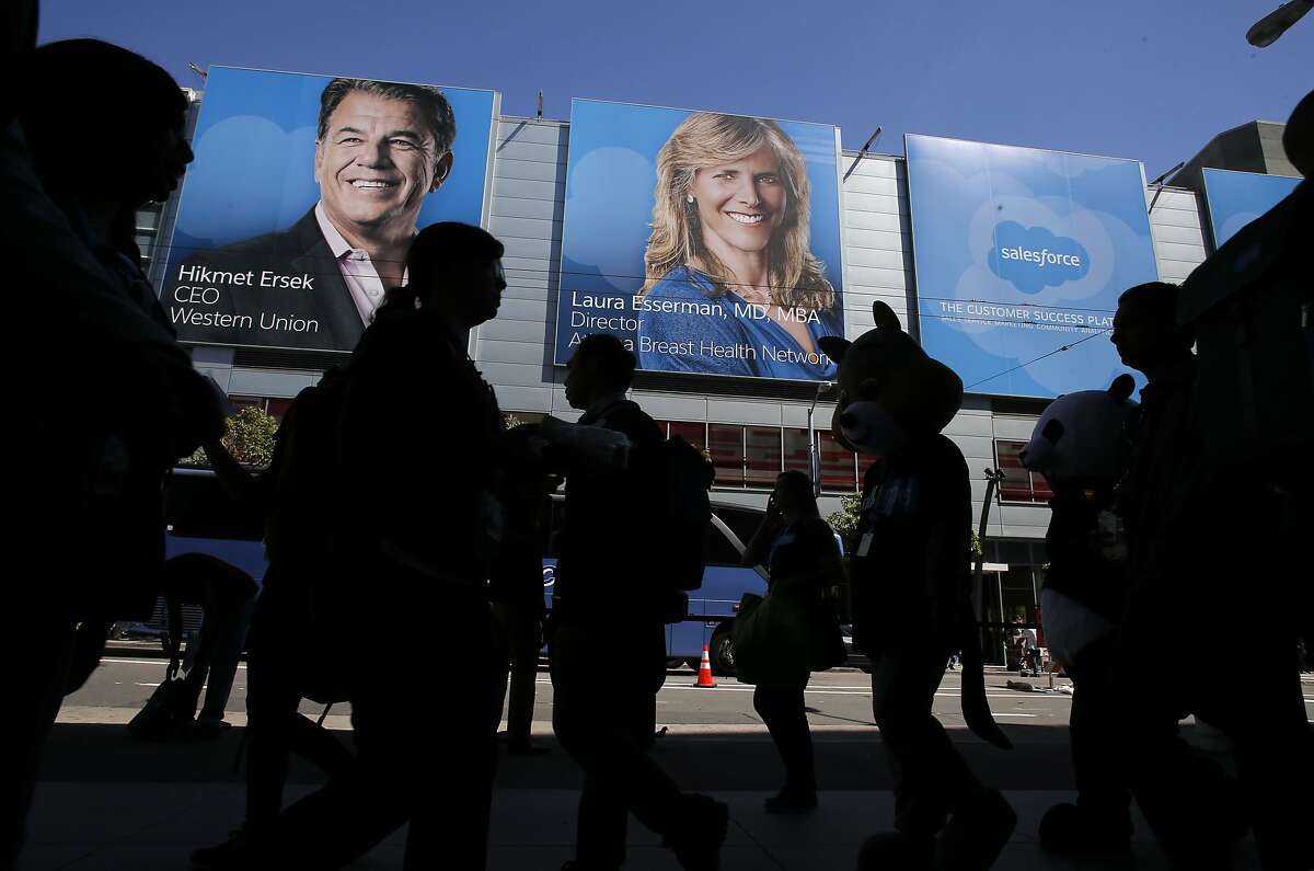 Posters show keynote speakers along Howard St. as Dreamforce gets underway at the Moscone Center in downtown San Francisco, Calif., on Tues. September 15, 2015.