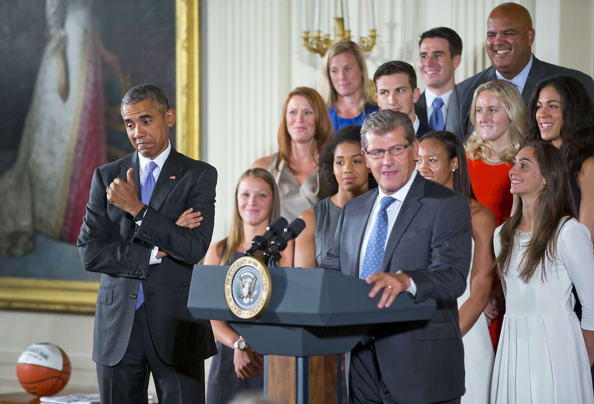 President Barack Obama gives a 'thumbs-up' as he reacts to remarks made by UConn Huskies Women's basketball head coach Geno Auriemma, Tuesday, Sept. 15, 2015, in the East Room of the White House in Washington during a ceremony where the president honored the NCAA Champion UConn Huskies Women's Basketball. (AP Photo/Pablo Martinez Monsivais)