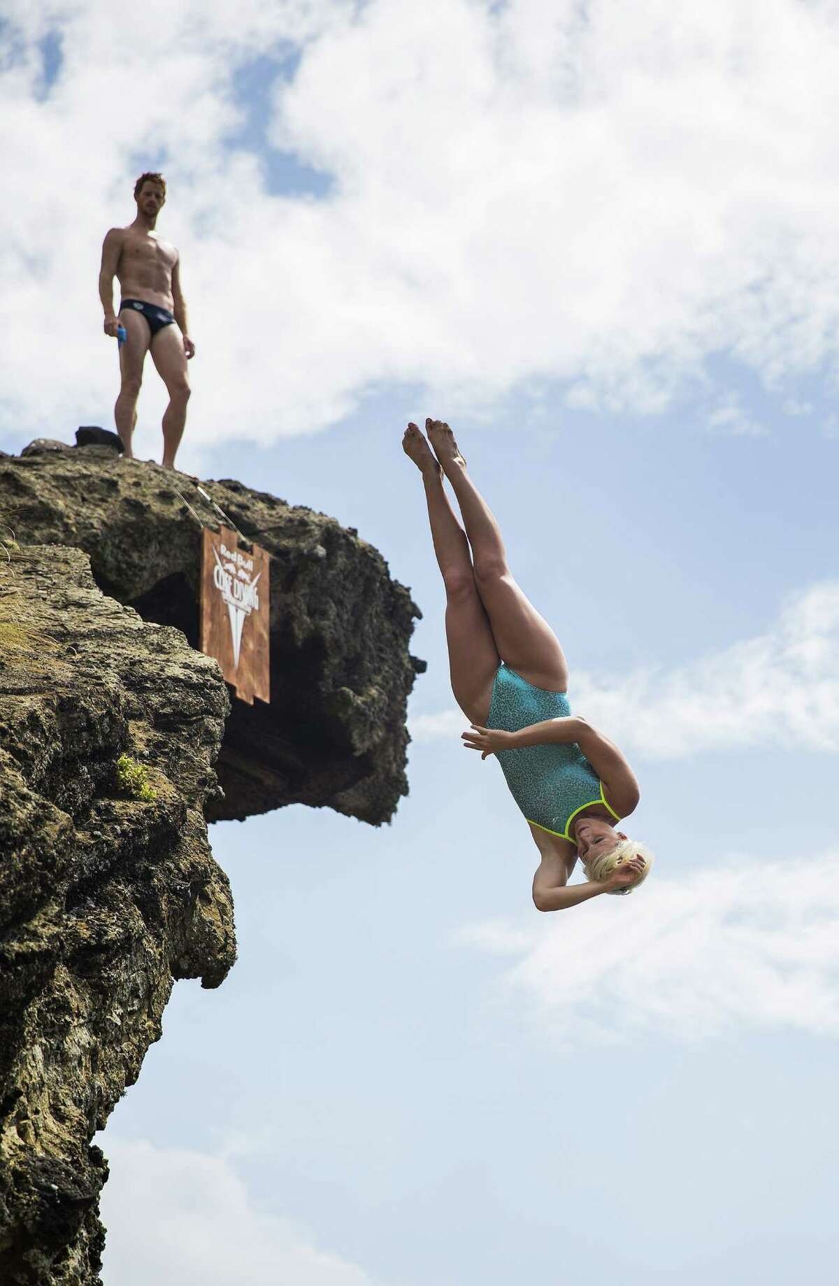 In this handout image provided by Red Bull, Rachelle Simpson of the USA dives from the 20 meter platform during the fifth stop of the Red Bull Cliff Diving World Series on July 18, 2015 in Islet Franca do Campo, Azores, Portugal.