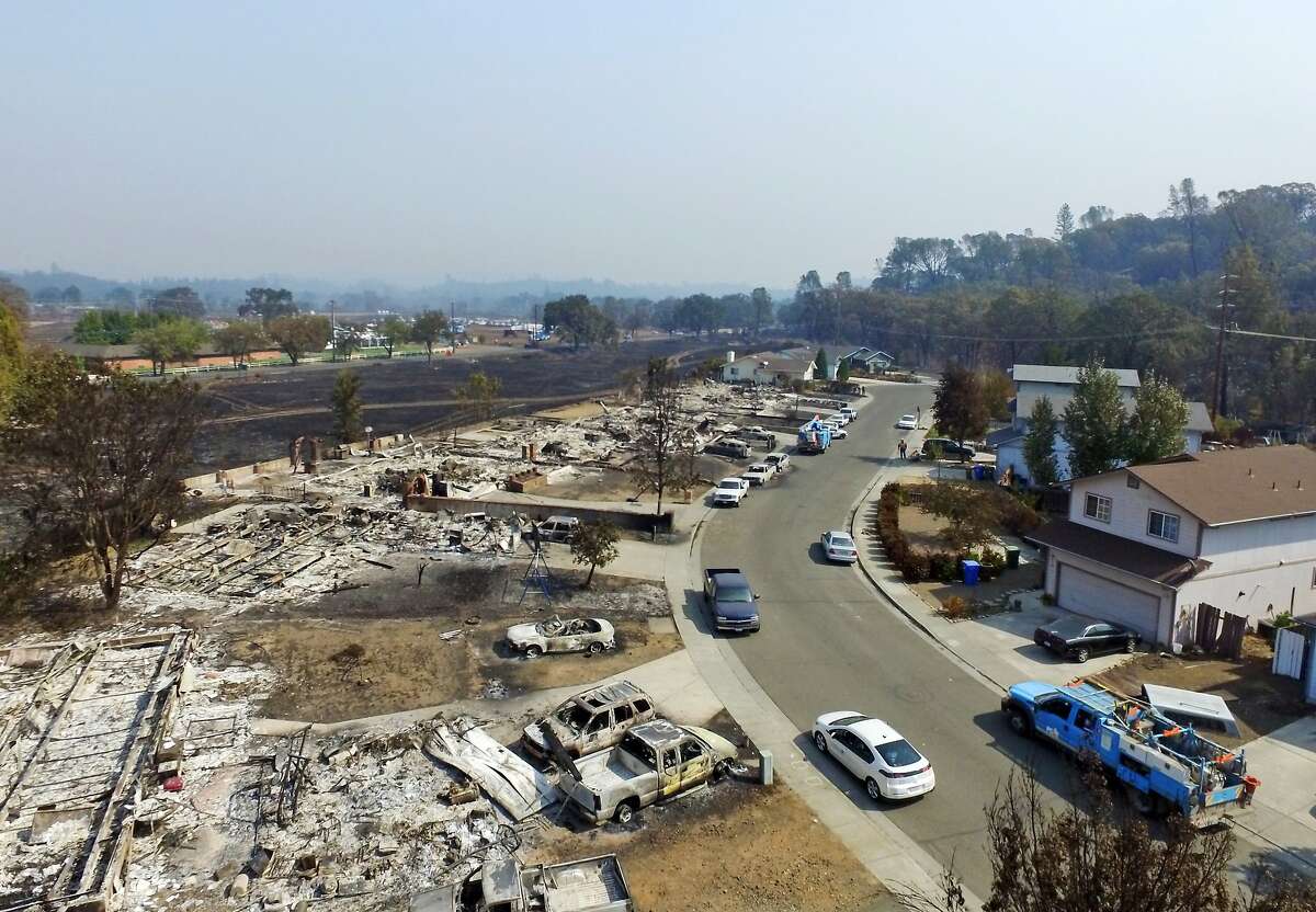 This image taken with a drone shows a street in Middletown, Calif., where several homes were completely destroyed by the Lake County wildfire, Tuesday, Sept. 15, 2015. The fire that sped through Middletown and other parts of rural Lake County, less than 100 miles north of San Francisco, has continued to burn since Saturday despite a massive firefighting effort. (AP Photo/Brian Skoloff)