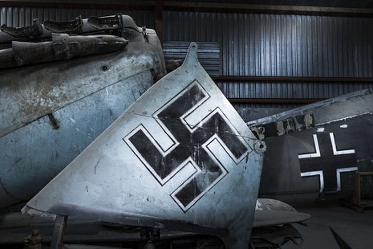 A world-class collection of antique war planes, including one that fended off a Nazi attack on Britain 75 years ago, sat dusty in the hangar of a West Texas oilman for decades. Nazi symbols were painted on these Spanish planes for the 1969 film Battle of Britain.  Photo credit: Chris Rose / Aircraft Owners and Pilots Association