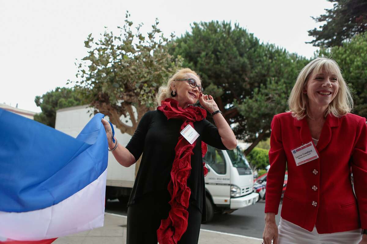 Joan Leone (left), president of The Nob Hill Republican Women's Club, and Lynne Crawford hang decorations for the debate watch party at the Italian Athletic Club in North Beach on Wednesday, Sept. 16, 2015 in San Francisco, Calif.