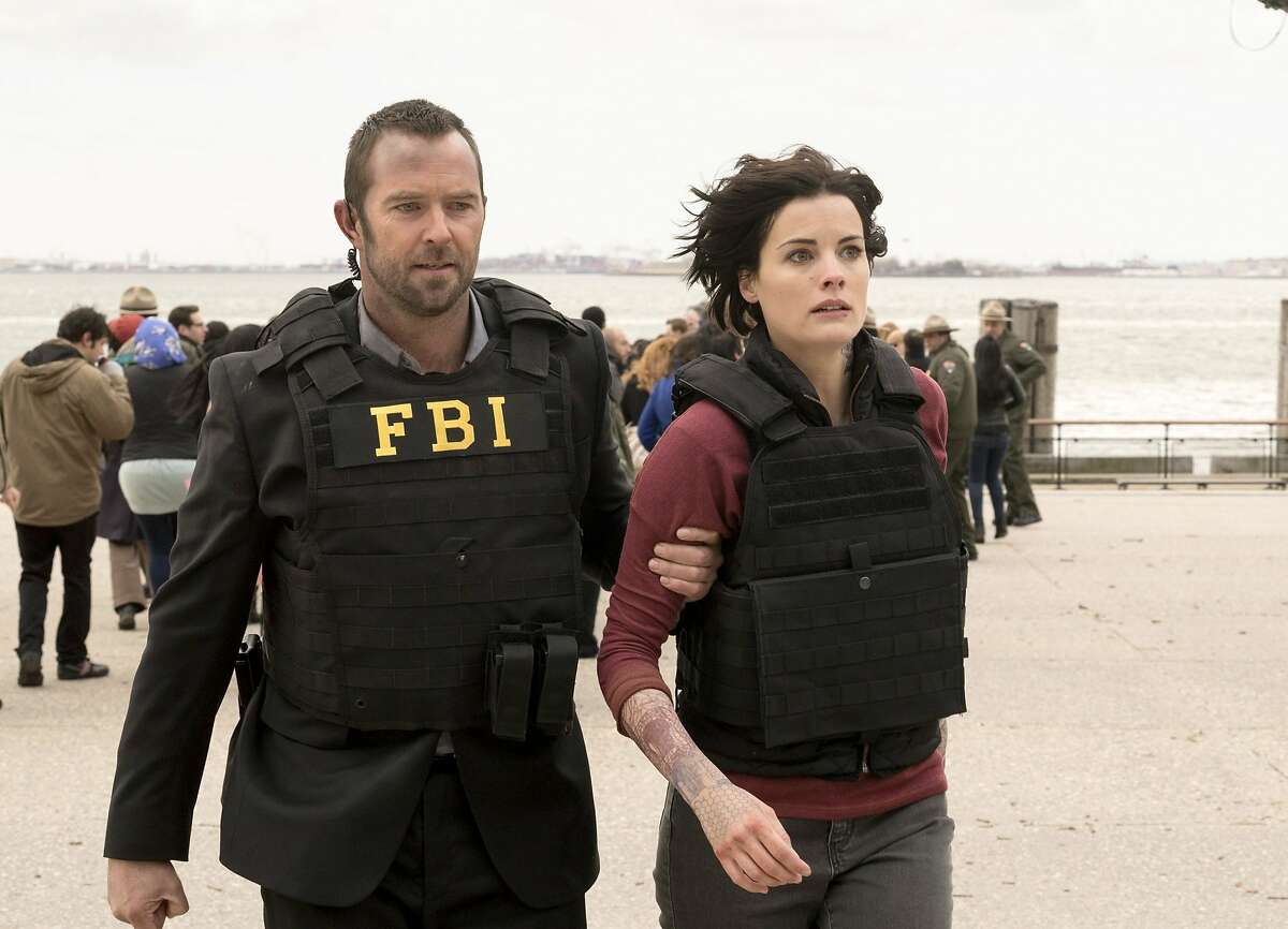 In this image released by NBC, Sullivan Stapleton, left, and Jaimie Alexander appear in a scene from "Blindspot," premiering Sept. 21 on NBC. (Virginia Sherwood/NBC via AP)