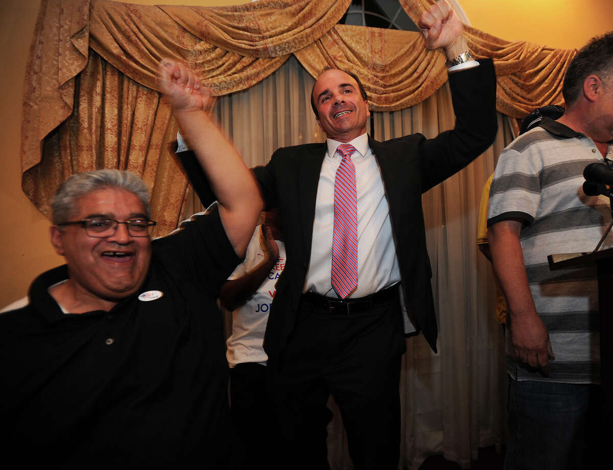 Eddie Moro, left, celebrates with former Bridgeport Mayor Joseph Ganim at Testo's Restaurant in Bridgeport, Conn. after Ganim won the Democratic mayoral primary on Wednesday, September 16, 2015.
