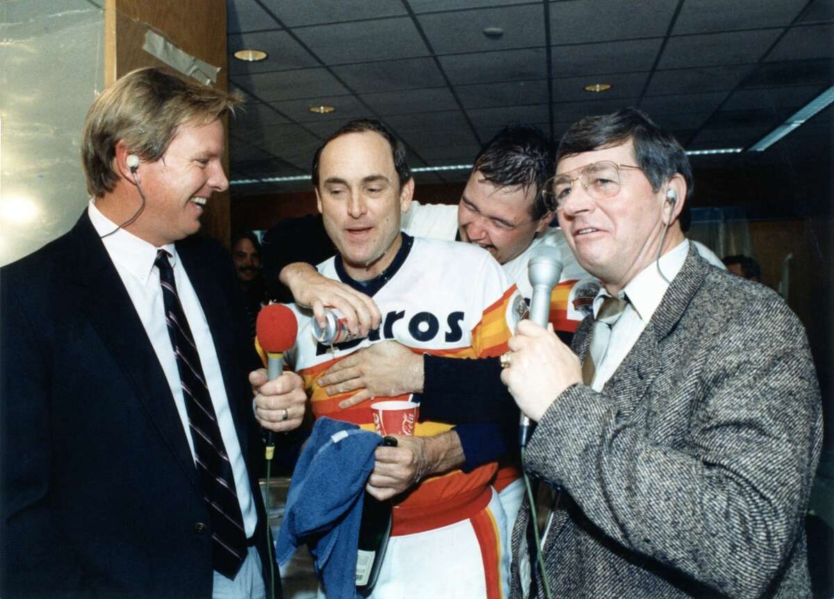 September 1986: Houston Astros announcers Larry Dierker, left, and Milo Hamilton, right, try to interview Nolan Ryan after the Astros clinched the NL West division title.