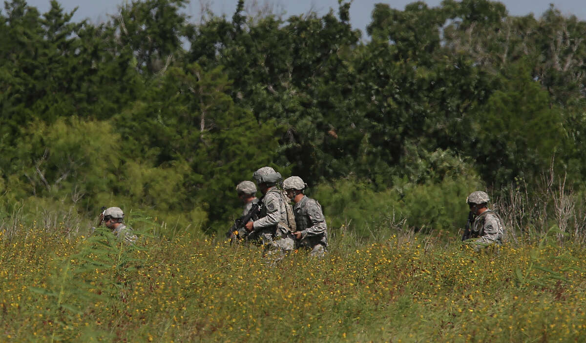FILE: Military personnel train at Camp Swift north of Bastrop,Texas, Wednesday, July 15, 2015 during the U.S. Army Special Operations exercise, "Jade Helm 15."