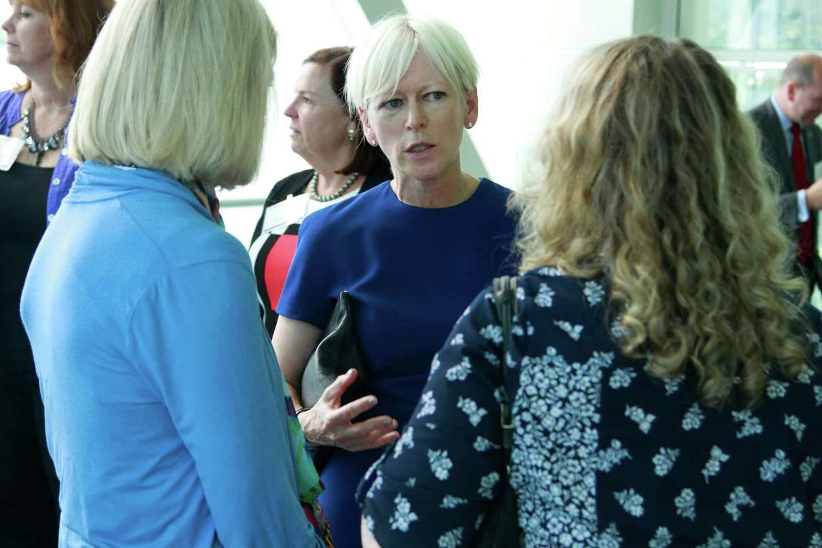 Joanna Coles, Editor-in-Chief of Cosmopolitan and Editorial Director of Hearst Magazines, center, chats with attendees of the Women Entrepreneurs Empowerment Forum during a meet and greet VIP reception prior to a luncheon where Coles sat down with University of Connecticut President Susan Herbst for a Q&A in Stamford on Friday Sept. 18, 2015.