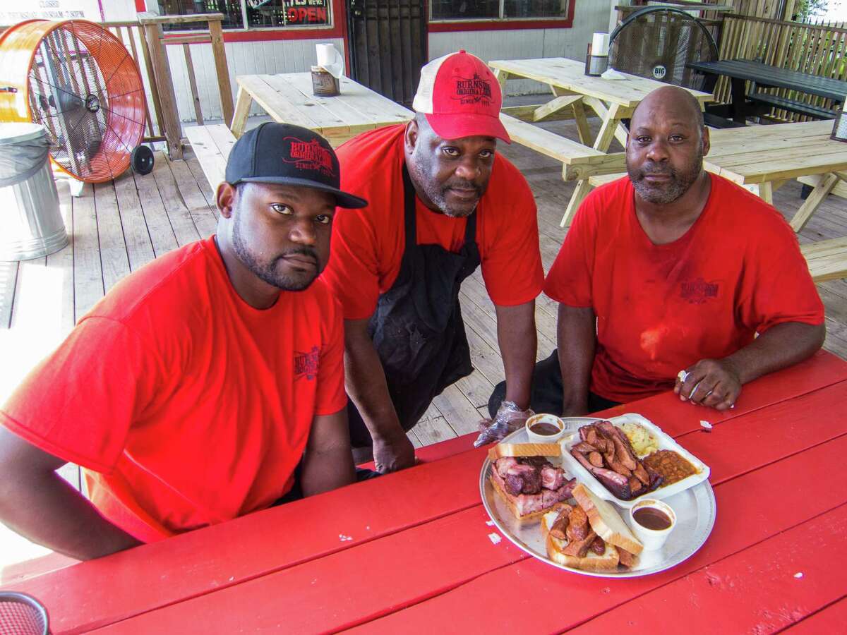 Cory Crawford, from left, Gary Burns and Steve Burns are three of the men behind Burns Original BBQ.﻿
