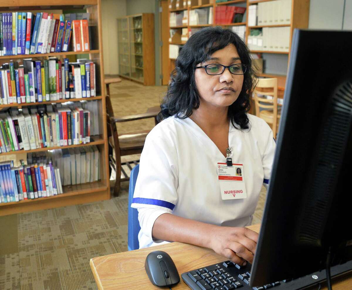 Samaritan School of Nursing student Vera Persaud of Schenectady works in the library of their new school facilities at St. Mary's Hospital Friday Sept. 18, 2015 in Troy, NY. (John Carl D'Annibale / Times Union)